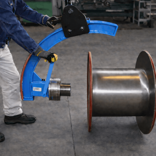 Worker using manual reel tilter